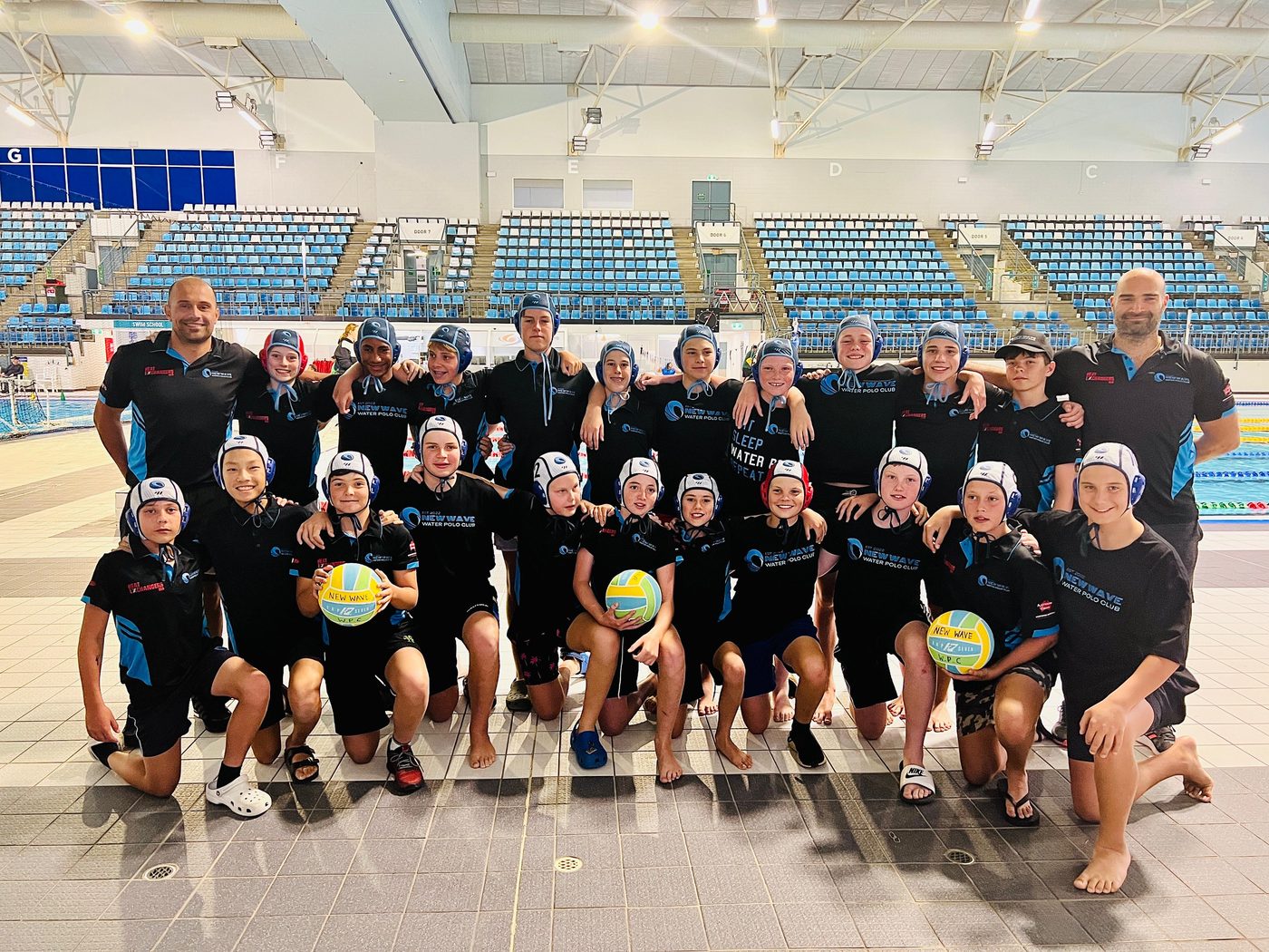 New Wave junior teams and coaches together at the pool