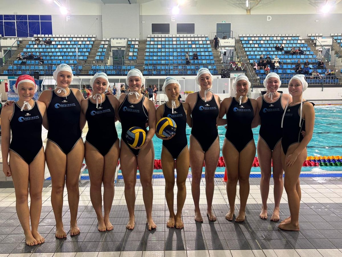 New Wave junior girls team poolside