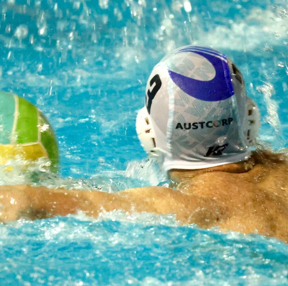 New Wave player wearing a cap with AUSTCORP branding in a game